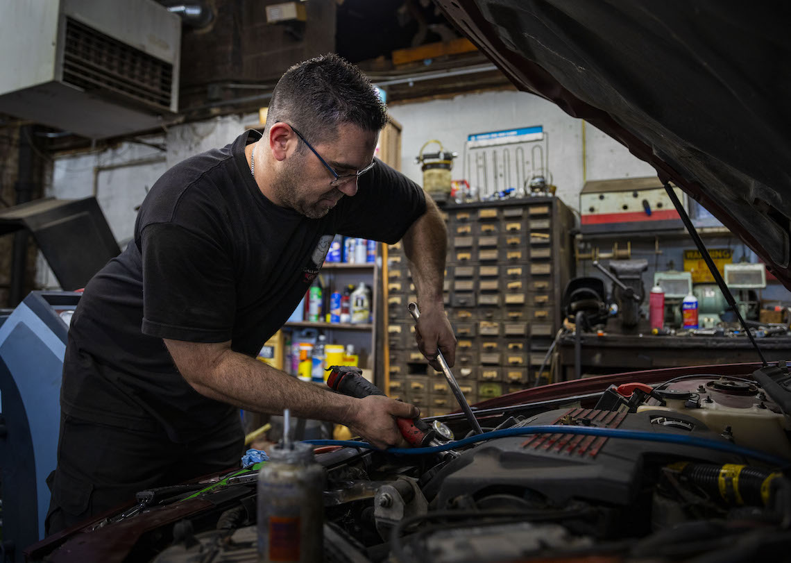 Galloping Ghost mechanic works on car engine.